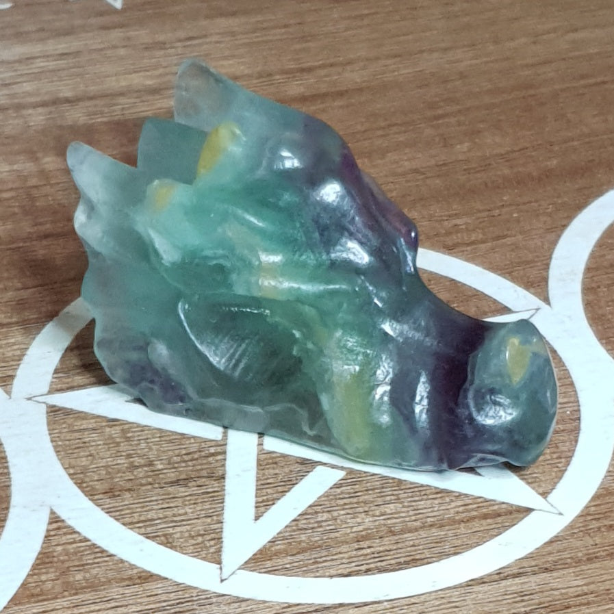 Rainbow Fluorite Dragon Skull Crystal Carving.