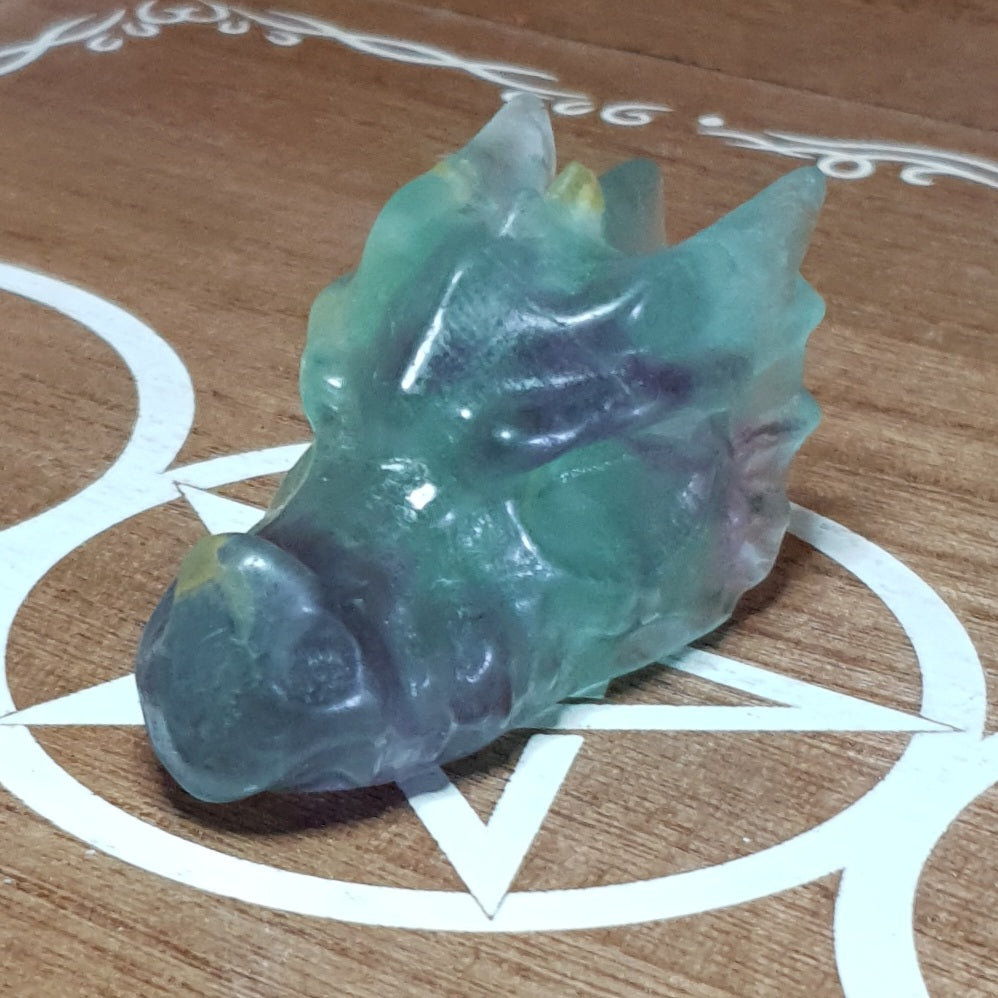 Rainbow Fluorite Dragon Skull Crystal Carving.