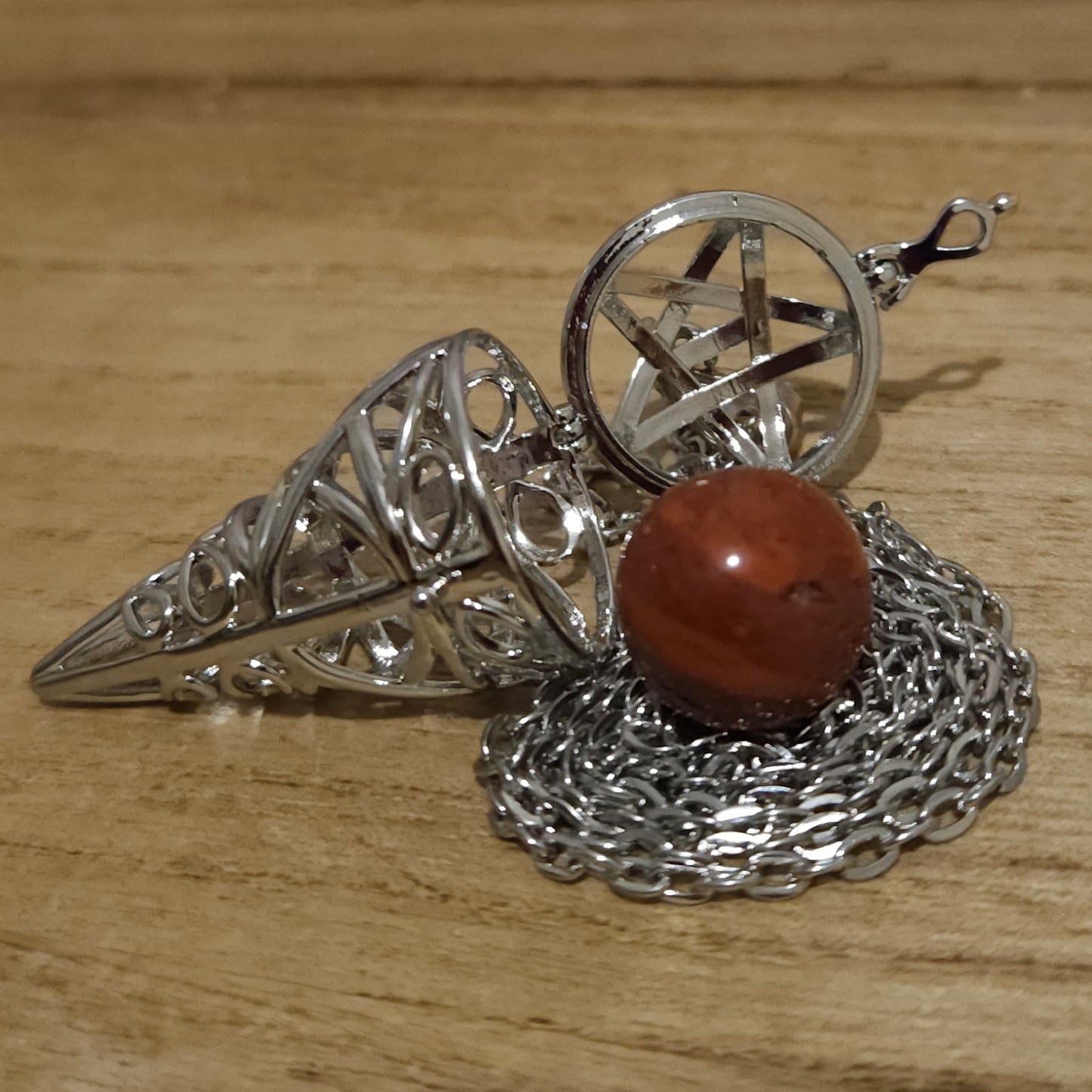 Pentagram Cone Shaped Cage with Red Jasper Sphere.