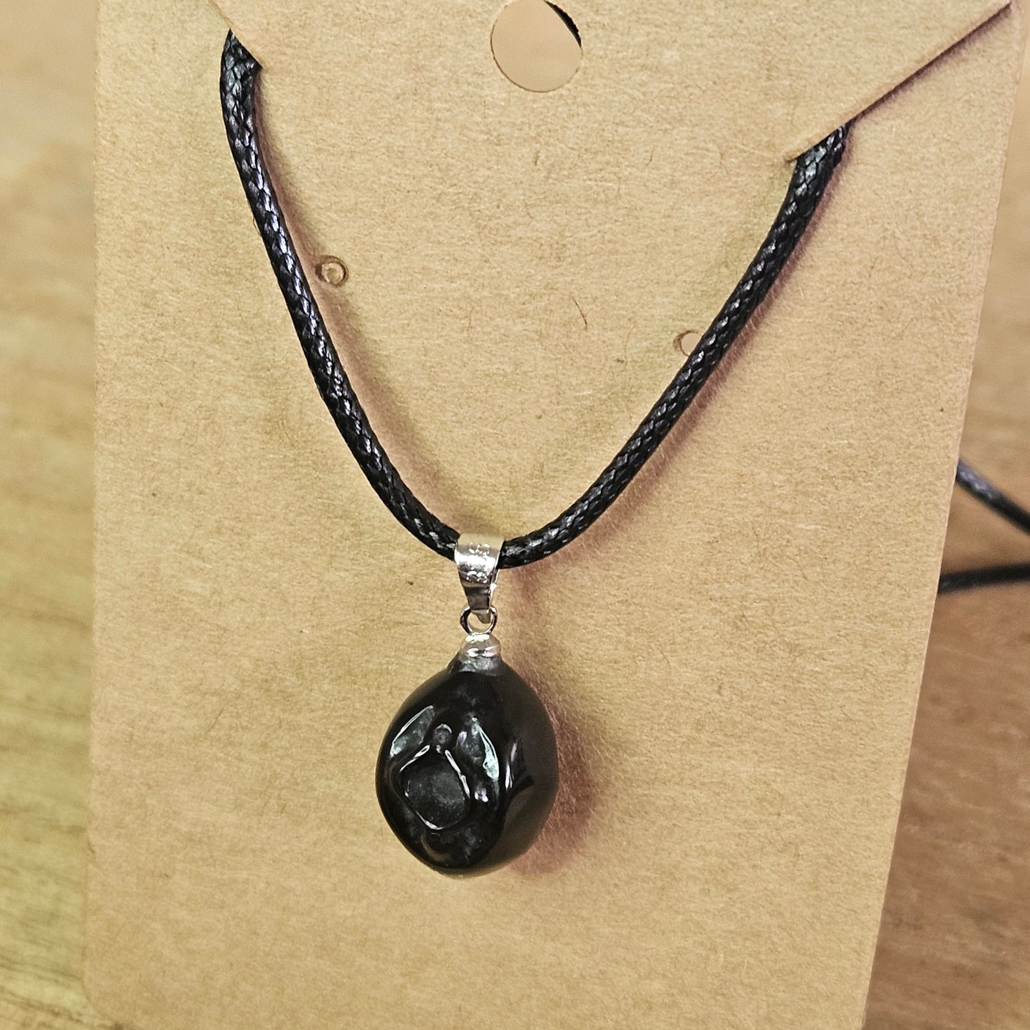 Obsidian Vagina Necklace.
