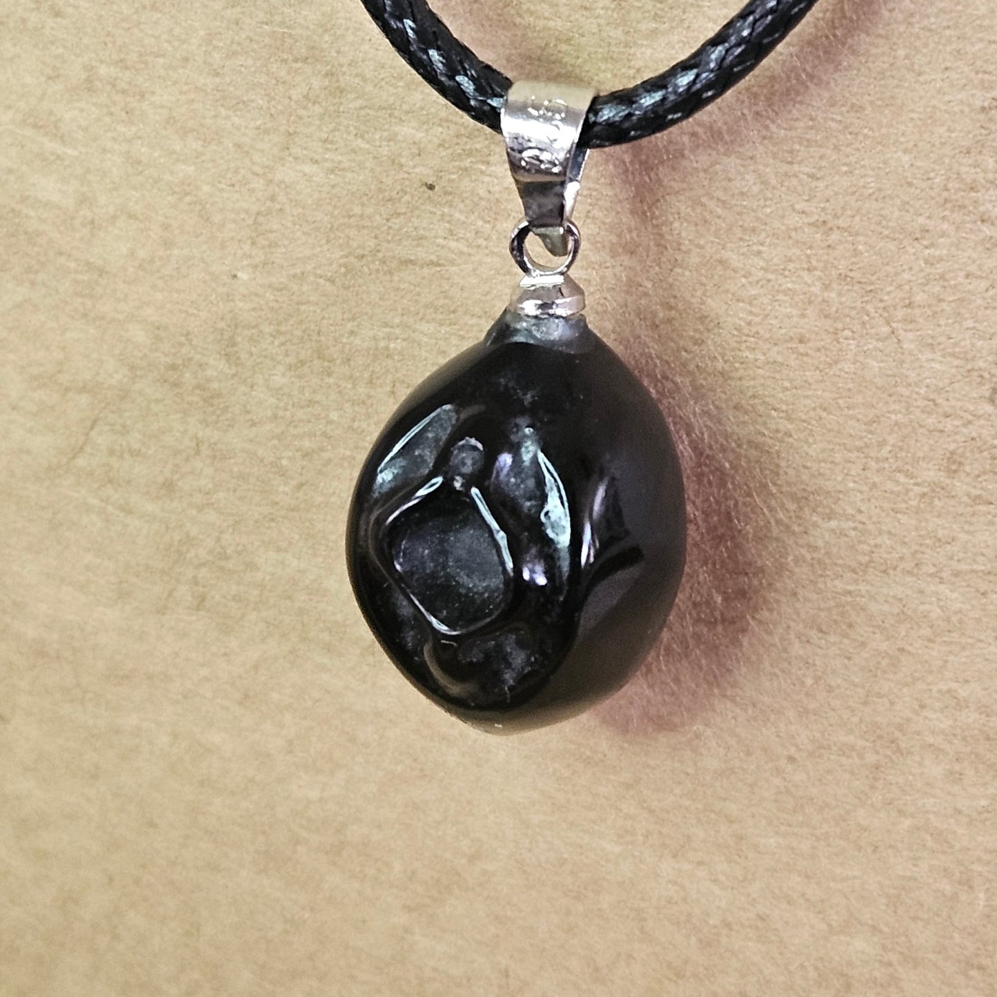 Obsidian Vagina Necklace.