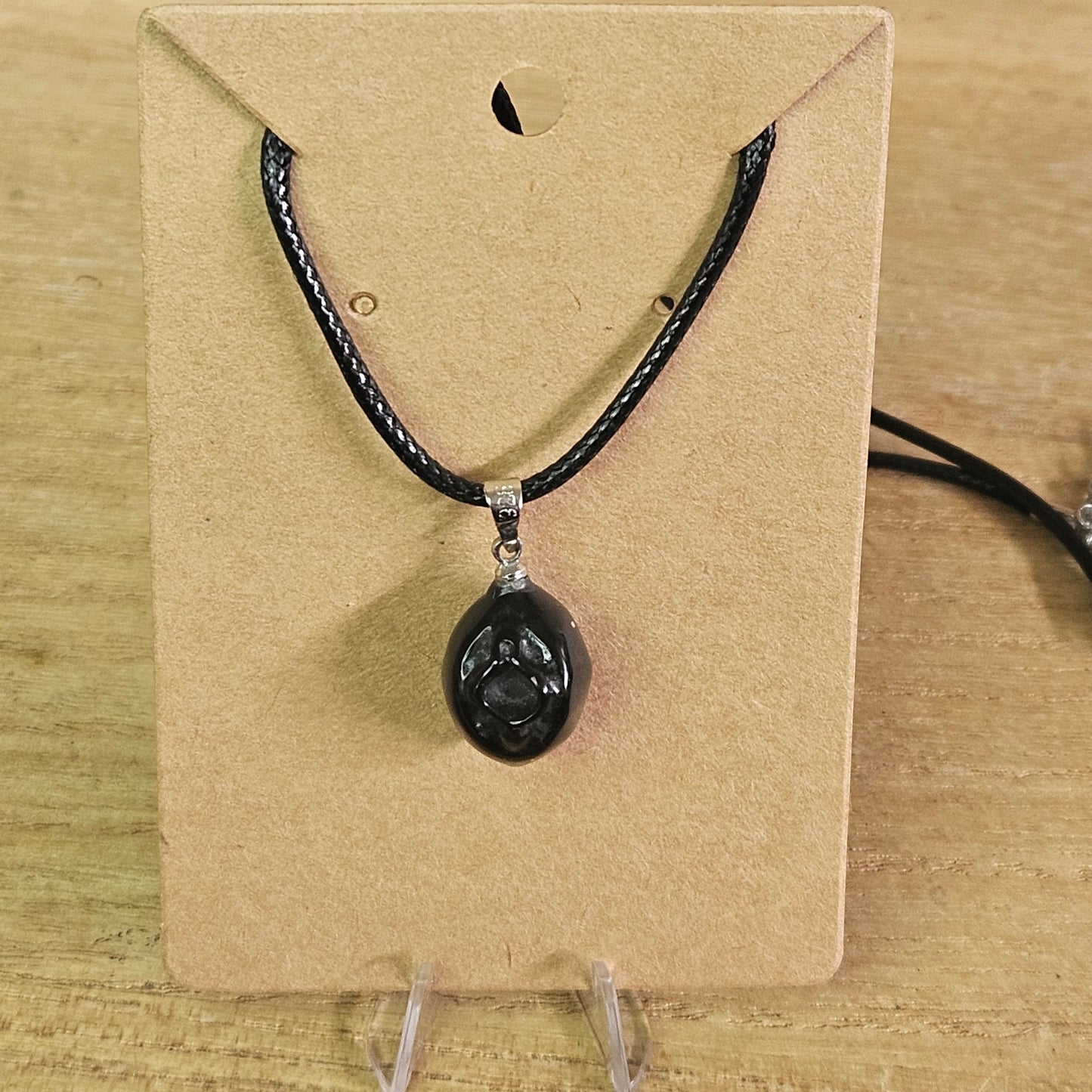 Obsidian Vagina Necklace.