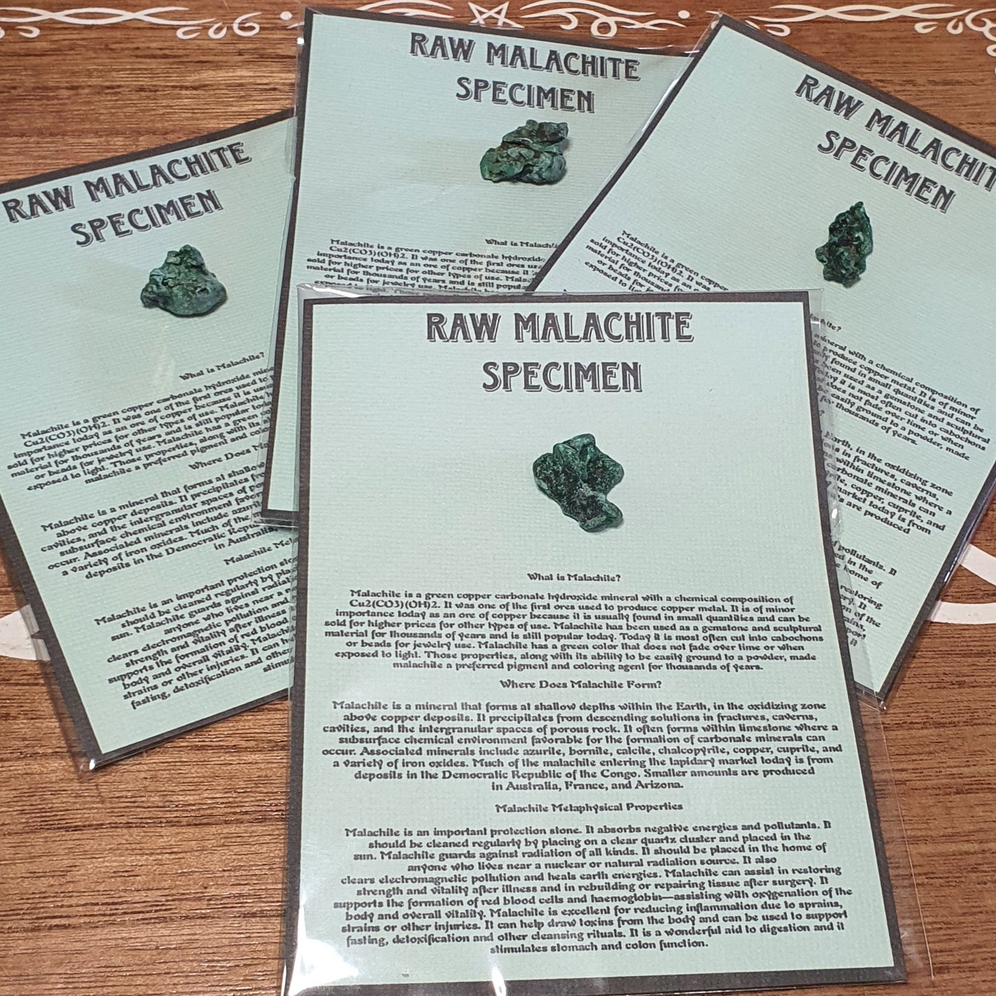 Raw Malachite Specimen and Information sheet.