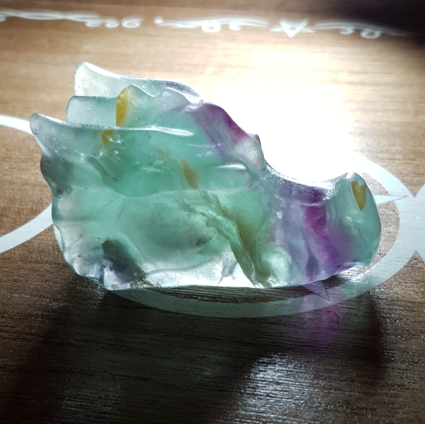 Rainbow Fluorite Dragon Skull Crystal Carving.