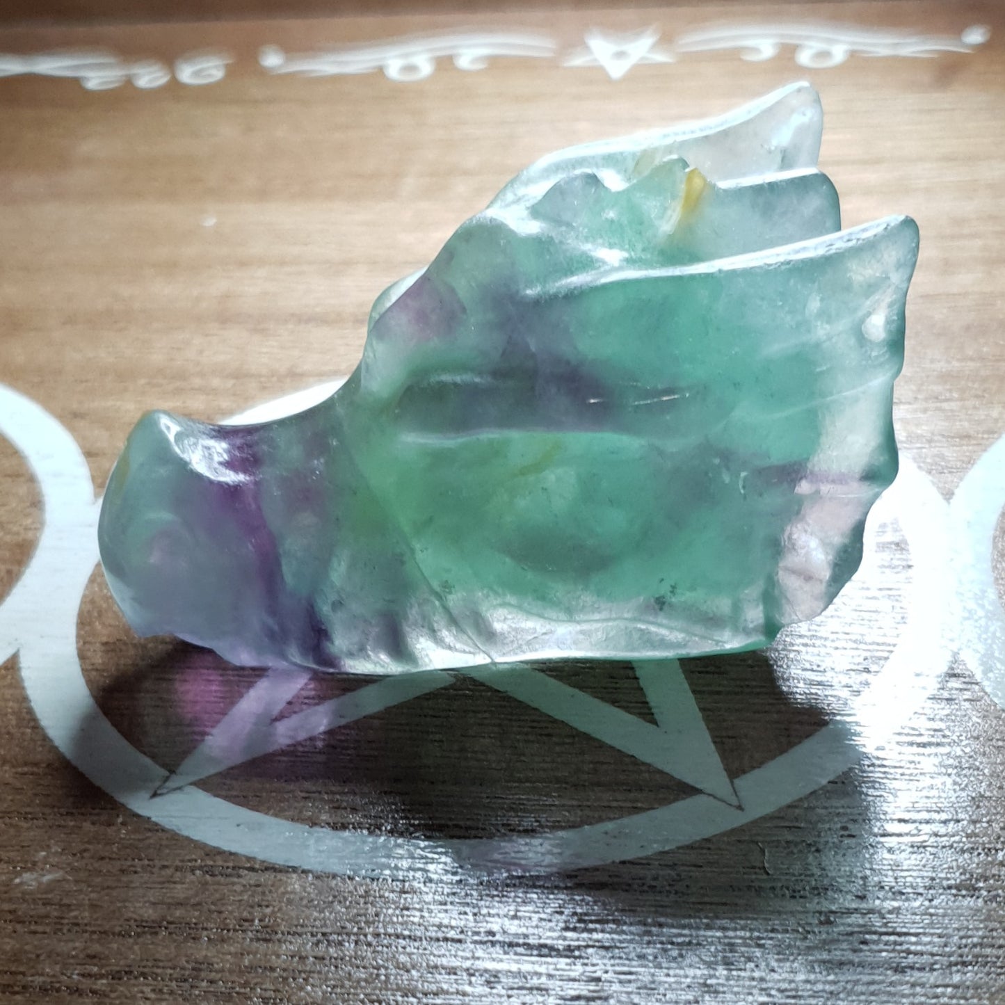 Rainbow Fluorite Dragon Skull Crystal Carving.