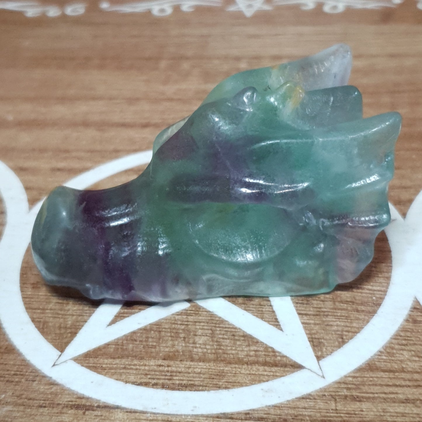 Rainbow Fluorite Dragon Skull Crystal Carving.