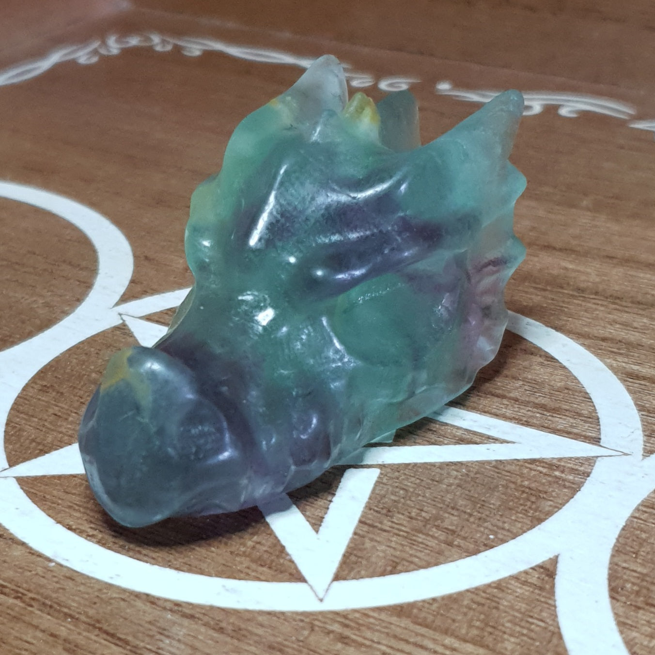 Rainbow Fluorite Dragon Skull Crystal Carving.