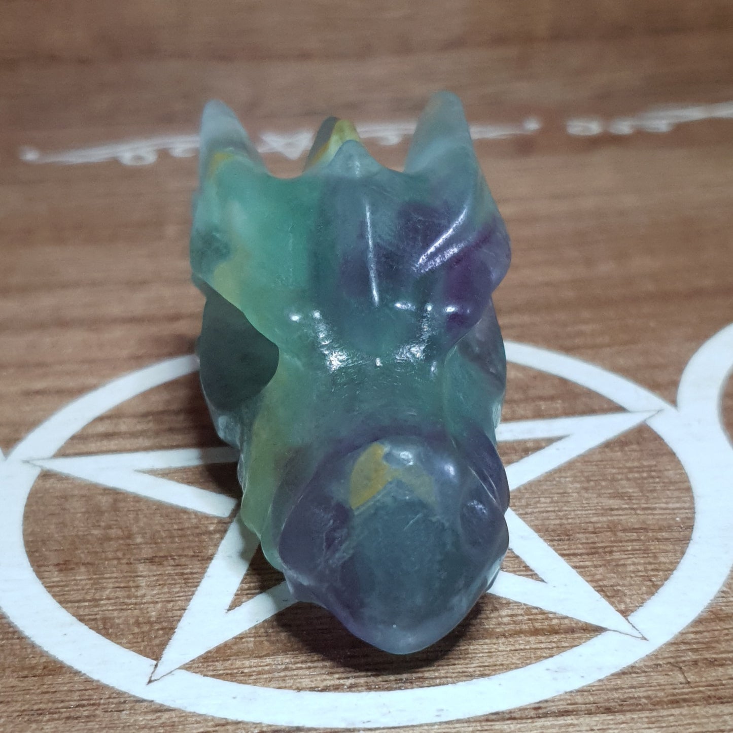 Rainbow Fluorite Dragon Skull Crystal Carving.