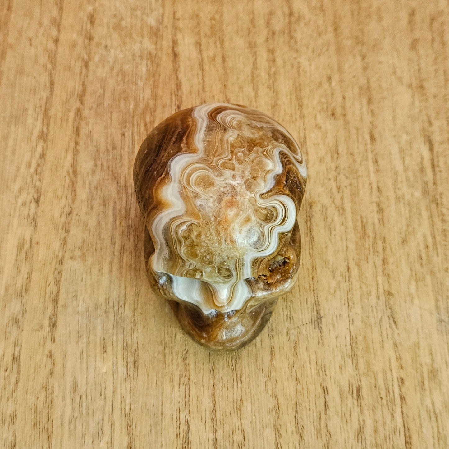 Banded Amber Calcite Skull Carving.