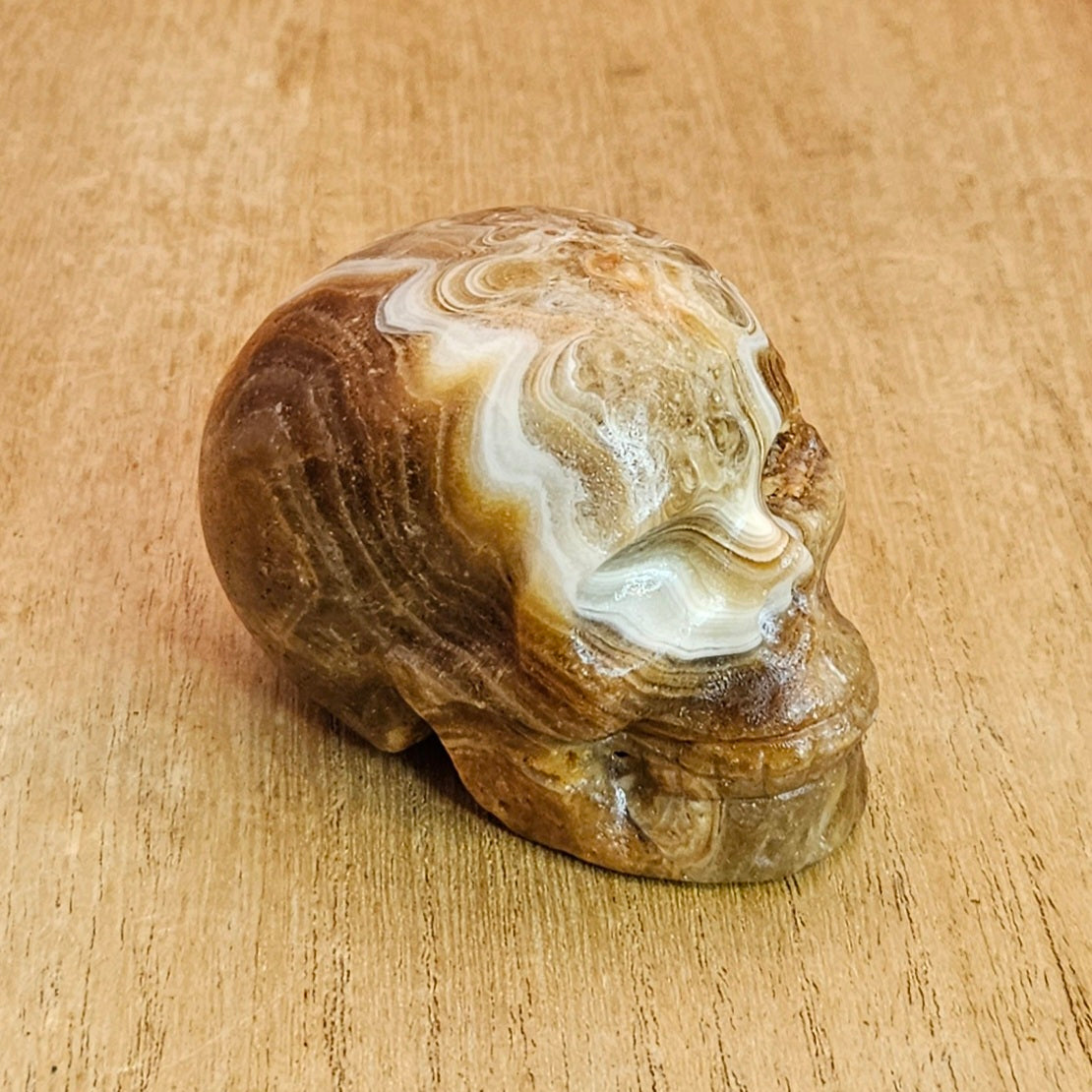 Banded Amber Calcite Skull Carving.