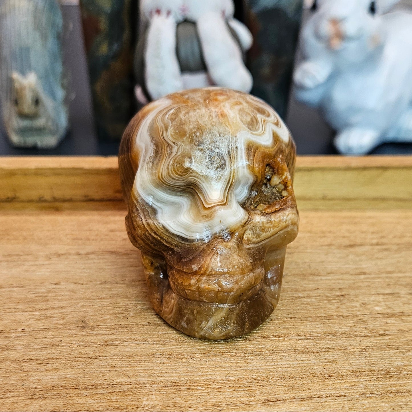 Banded Amber Calcite Skull Carving.