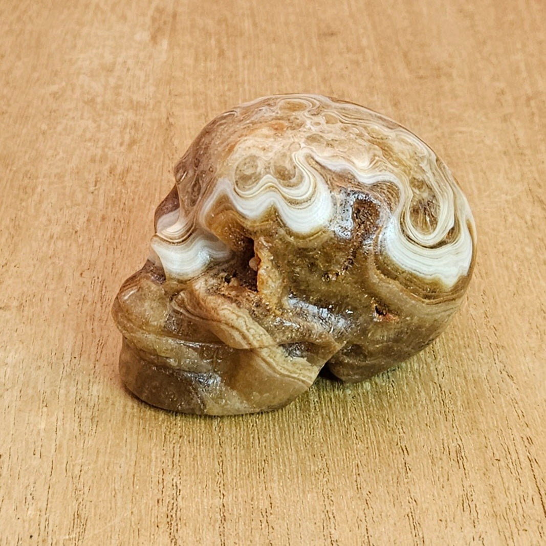 Banded Amber Calcite Skull Carving.